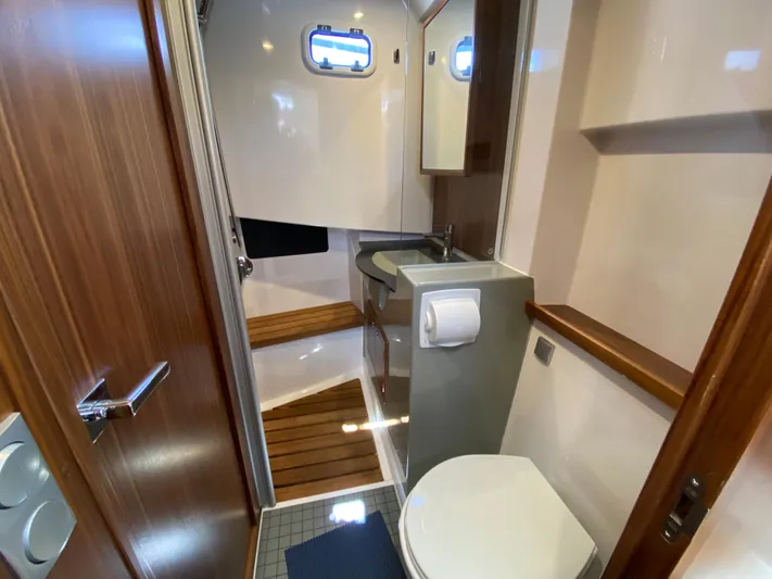Ursa Yacht Photos Pics 2019 Sargo 36 Explorer bathroom with wooden accents and modern fixtures.