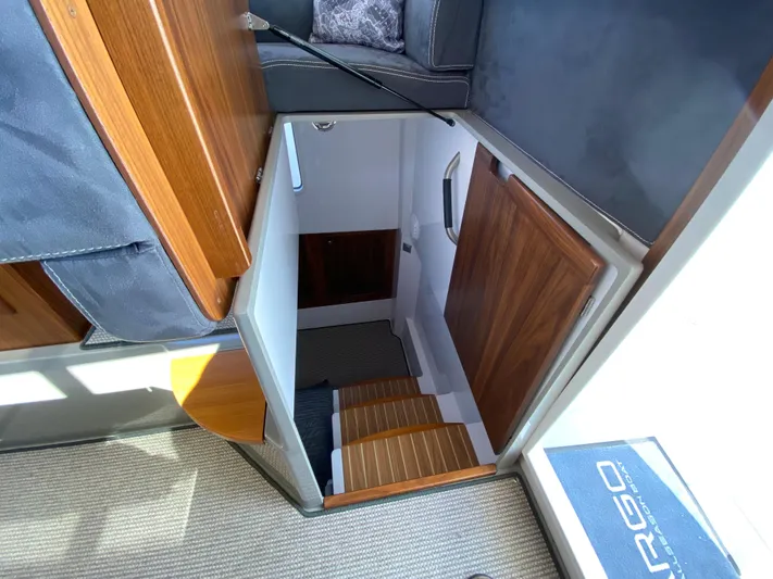 Ursa Yacht Photos Pics Interior view of 2019 Sargo 36 Explorer, showcasing wooden stairs and cabin entrance.