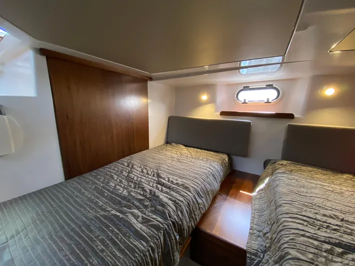 Ursa Yacht Photos Pics 2019 Sargo 36 Explorer cabin with twin beds, wooden accents, and soft lighting.