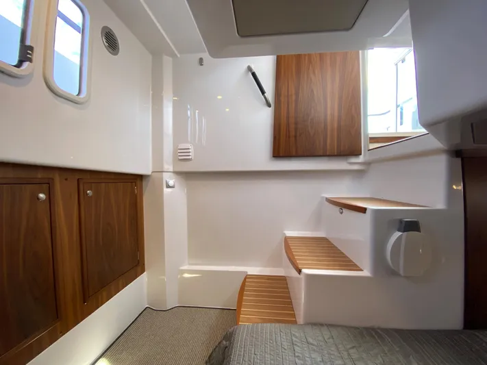 Ursa Yacht Photos Pics Interior of 2019 Sargo 36 Explorer boat with wooden cabinets and stairs.