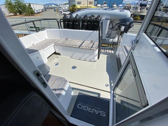 Ursa Yacht Photos Pics 2019 Sargo 36 Explorer boat deck with seating and equipment, docked at a marina.