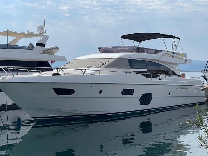  Yacht Photos Pics 2012 Ferretti Yachts 690 docked, showcasing sleek design and luxury features.