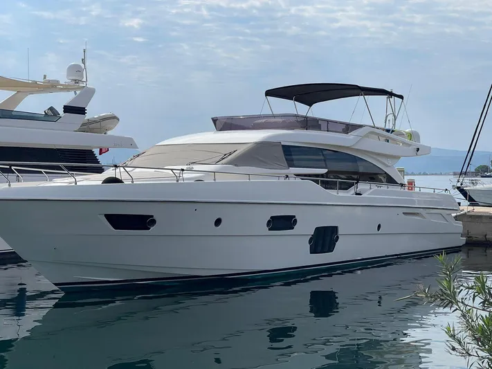  Yacht Photos Pics 2012 Ferretti Yachts 690 docked, showcasing sleek design and luxury features.