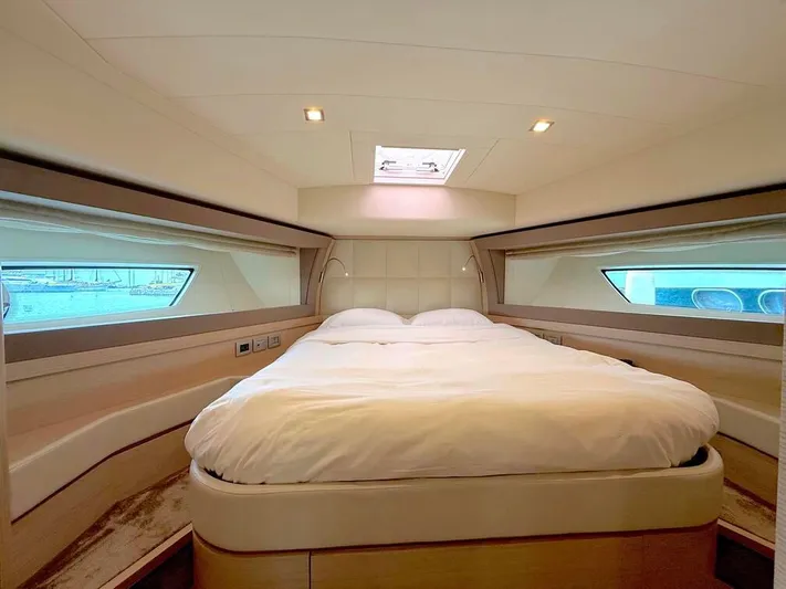  Yacht Photos Pics Luxurious bedroom interior of 2012 Ferretti Yachts 690 with elegant bedding and natural light.