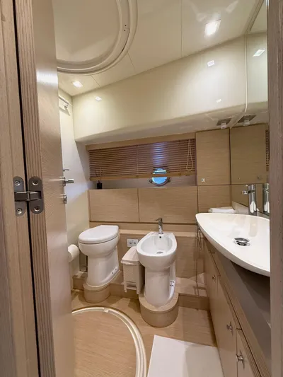  Yacht Photos Pics Luxurious bathroom in 2012 Ferretti Yachts 690, featuring modern fixtures and elegant design.