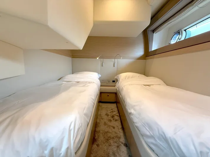  Yacht Photos Pics Twin bedroom in 2012 Ferretti Yachts 690, featuring modern design and cozy ambiance.