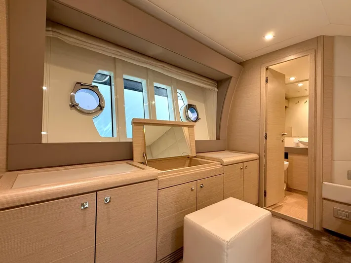  Yacht Photos Pics Luxurious interior of 2012 Ferretti Yachts 690 with elegant cabinetry and porthole windows.