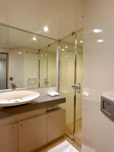  Yacht Photos Pics Luxurious bathroom in 2012 Ferretti Yachts 690, featuring modern fixtures and elegant design.