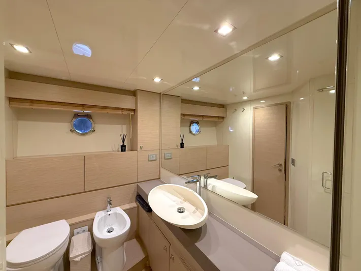  Yacht Photos Pics Luxurious bathroom interior of 2012 Ferretti Yachts 690 with modern fixtures and elegant design.