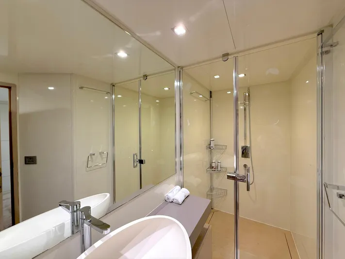  Yacht Photos Pics Luxurious bathroom in 2012 Ferretti Yachts 690, featuring modern fixtures and elegant design.