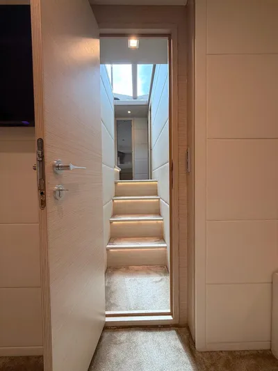  Yacht Photos Pics Interior view of 2012 Ferretti Yachts 690, featuring a stairway with natural light.