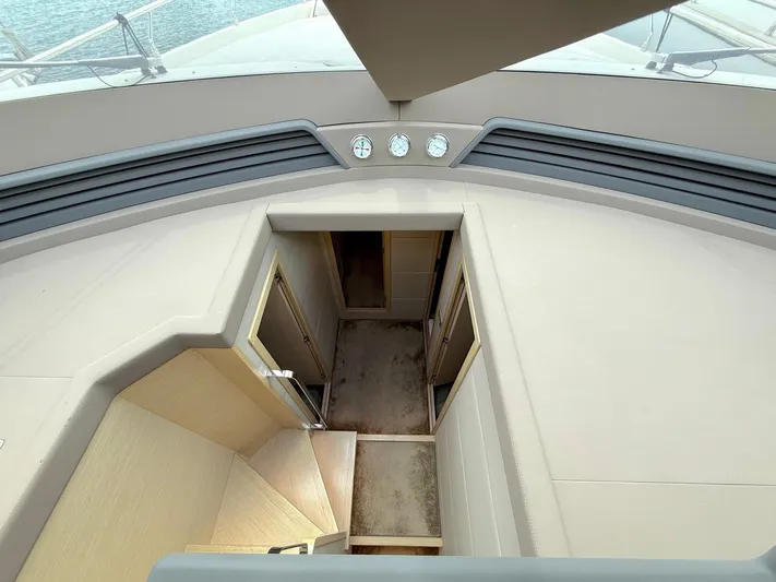  Yacht Photos Pics Interior view of 2012 Ferretti Yachts 690, featuring a staircase and modern design elements.