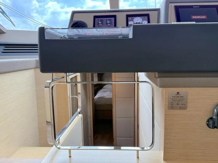  Yacht Photos Pics Interior view of 2012 Ferretti Yachts 690, featuring control panel and cabin entrance.