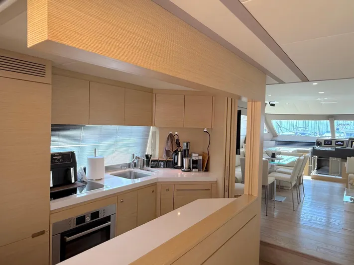  Yacht Photos Pics Luxurious kitchen interior of 2012 Ferretti Yachts 690 with modern appliances and elegant design.