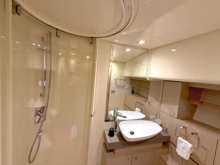  Yacht Photos Pics Luxurious bathroom in 2012 Ferretti Yachts 690 with modern fixtures and elegant design.