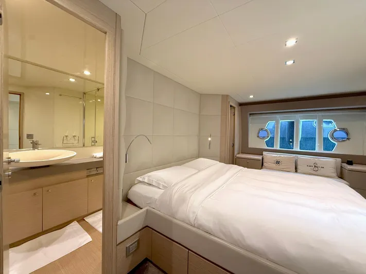  Yacht Photos Pics Luxurious bedroom interior of 2012 Ferretti Yachts 690 with modern design and elegant furnishings.