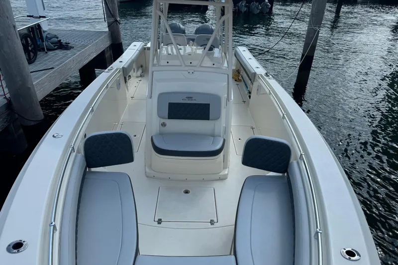 No Name Yacht Photos Pics 2018 Cobia 301 Center Console boat docked, featuring spacious seating and sleek design.