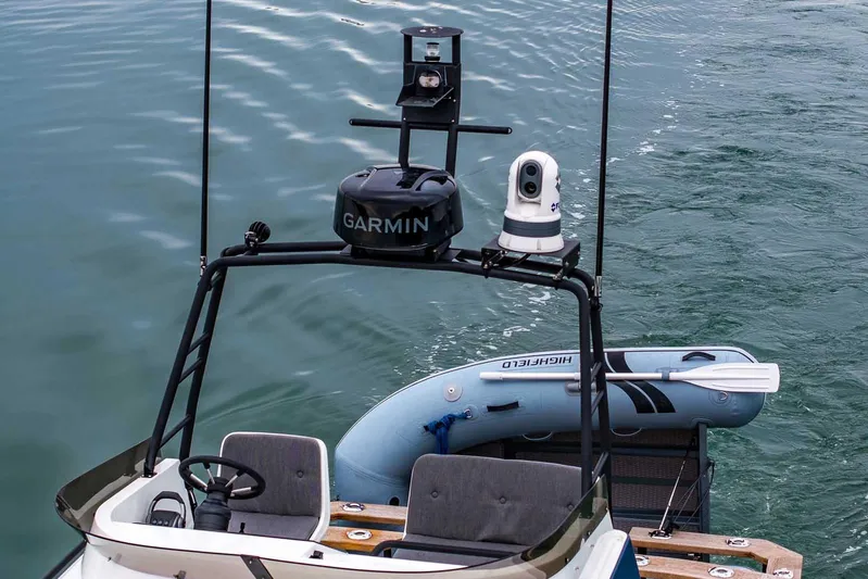  Yacht Photos Pics 2024 Targa 27.2 boat with Garmin equipment and inflatable dinghy on water.