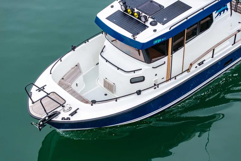  Yacht Photos Pics 2024 Targa 27.2 boat on water, showcasing sleek design and modern features.