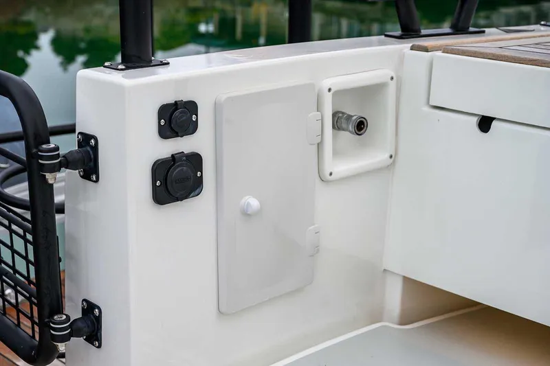  Yacht Photos Pics 2024 Targa 27.2 boat deck with utility connections and storage compartment.