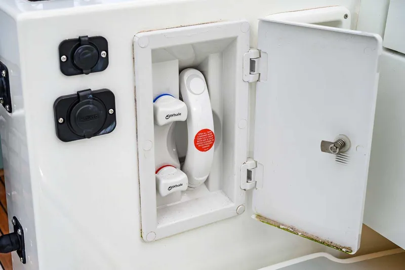  Yacht Photos Pics 2024 Targa 27.2 boat compartment with Whale water system controls.