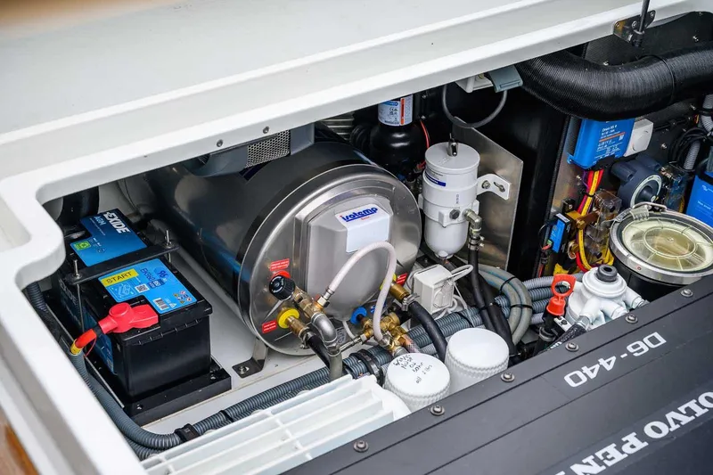  Yacht Photos Pics Engine compartment of 2024 Targa 27.2 boat, featuring Volvo Penta components and Exide battery.