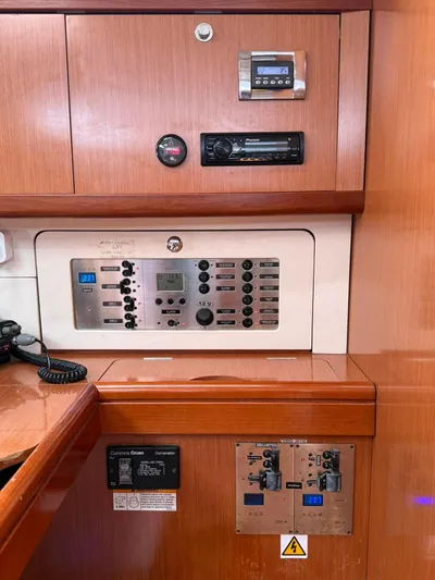 Yacht Photos Pics Control panel of a 2009 Beneteau Oceanis 54 yacht with navigation and electrical systems.