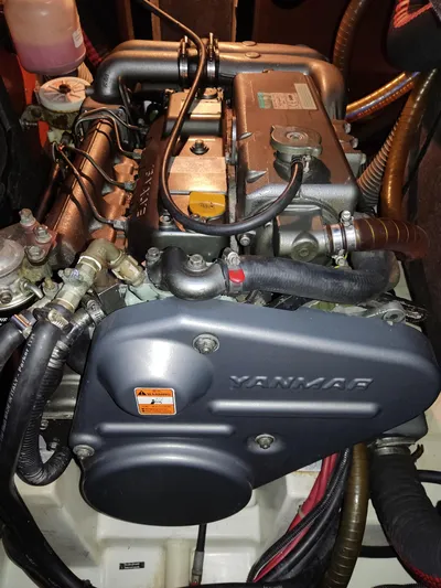  Yacht Photos Pics Yanmar engine in a 2009 Beneteau Oceanis 54 sailboat, showcasing detailed components.