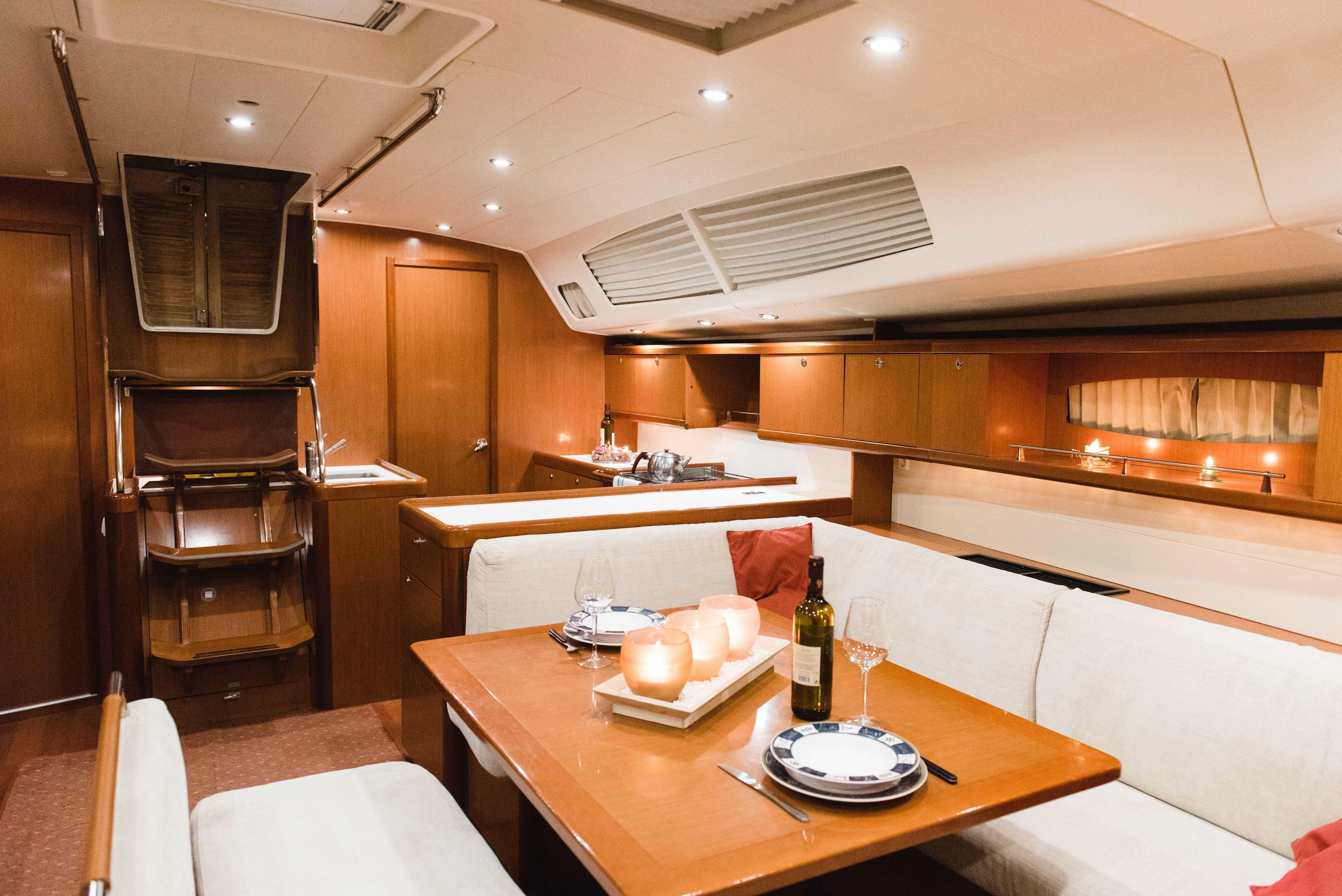  Yacht Photos Pics Luxurious interior of 2009 Beneteau Oceanis 54 yacht with elegant dining area.