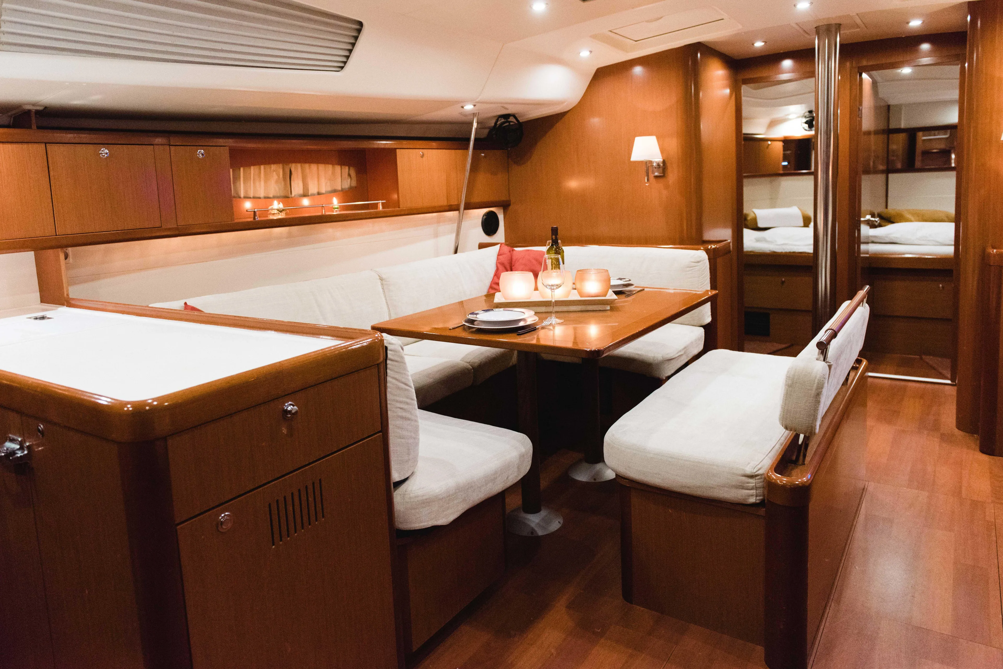  Yacht Photos Pics Luxurious interior of 2009 Beneteau Oceanis 54 yacht with elegant dining area.