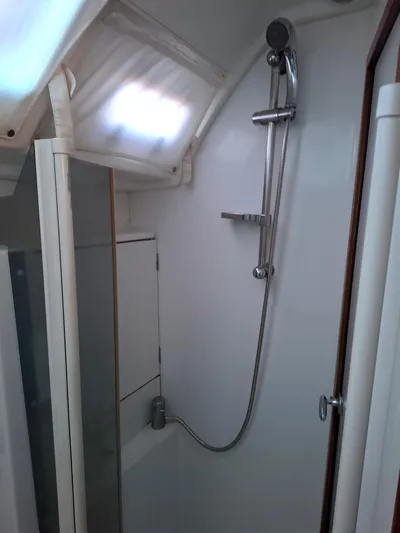  Yacht Photos Pics Shower area in 2009 Beneteau Oceanis 54 yacht, featuring modern fixtures and compact design.