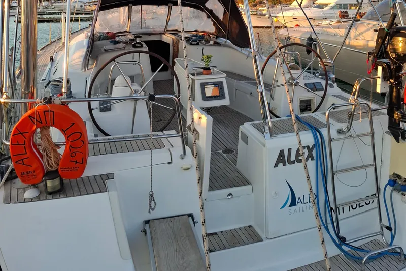  Yacht Photos Pics 2009 Beneteau Oceanis 54 sailboat deck with dual steering wheels and safety equipment.