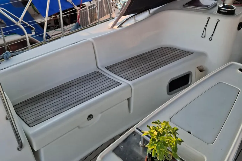  Yacht Photos Pics 2009 Beneteau Oceanis 54 yacht cockpit with seating and small plant.