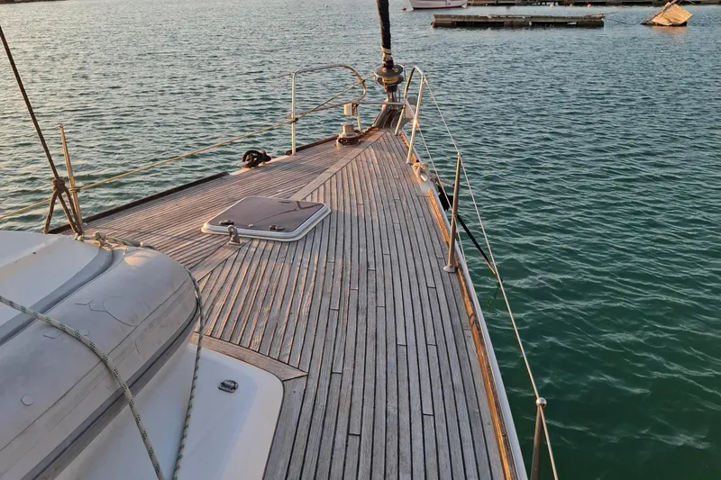  Yacht Photos Pics Deck view of a 2009 Beneteau Oceanis 54 yacht on calm waters.