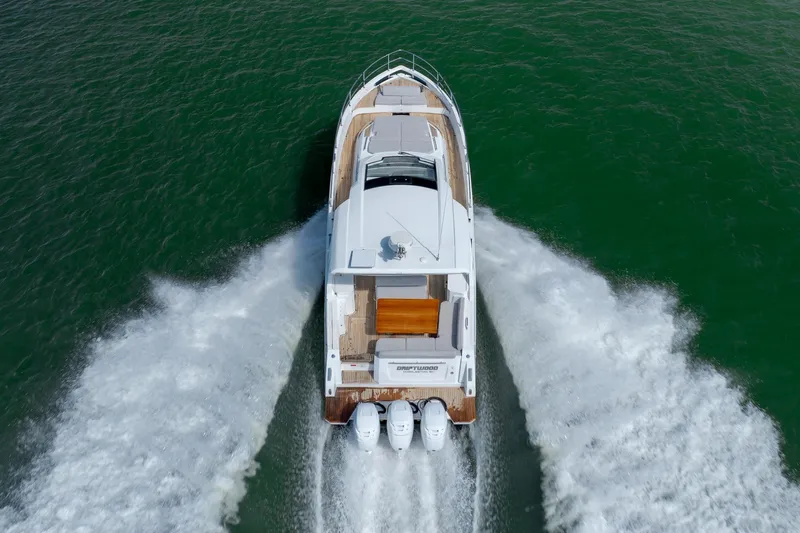  Yacht Photos Pics Aerial view of 2019 Azimut Verve 40 yacht cruising on green water.