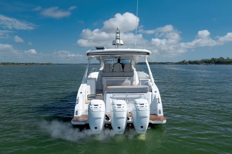  Yacht Photos Pics 2019 Azimut Verve 40 yacht on open water, rear view with triple engines.