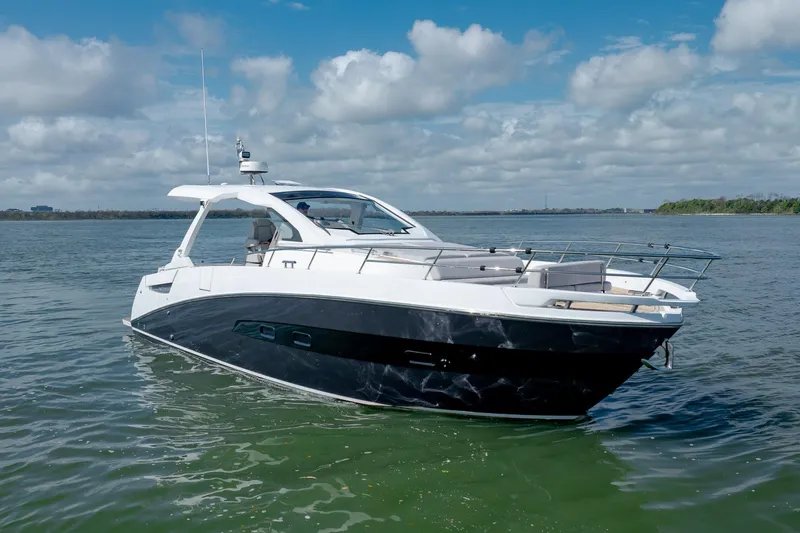  Yacht Photos Pics 2019 Azimut Verve 40 yacht on calm water under a partly cloudy sky.