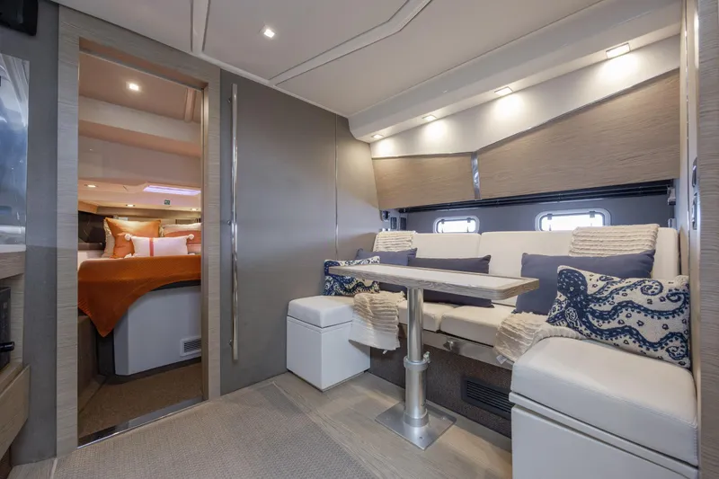  Yacht Photos Pics Luxurious interior of 2019 Azimut Verve 40 yacht with elegant seating and cozy bedroom.