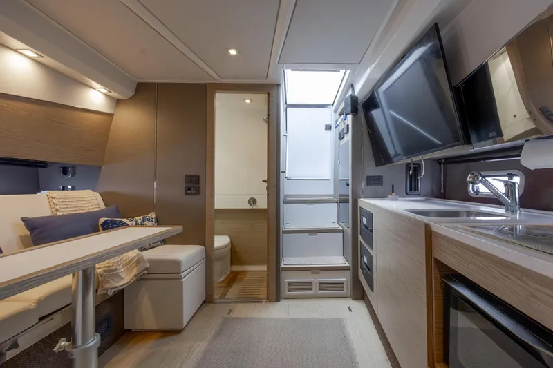  Yacht Photos Pics Luxurious interior of 2019 Azimut Verve 40 yacht with modern kitchen and seating area.