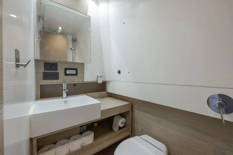  Yacht Photos Pics Modern bathroom interior on 2019 Azimut Verve 40 yacht, featuring sleek sink and storage.