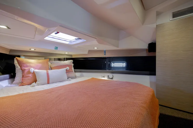  Yacht Photos Pics Luxurious cabin interior of 2019 Azimut Verve 40 yacht with cozy bedding.