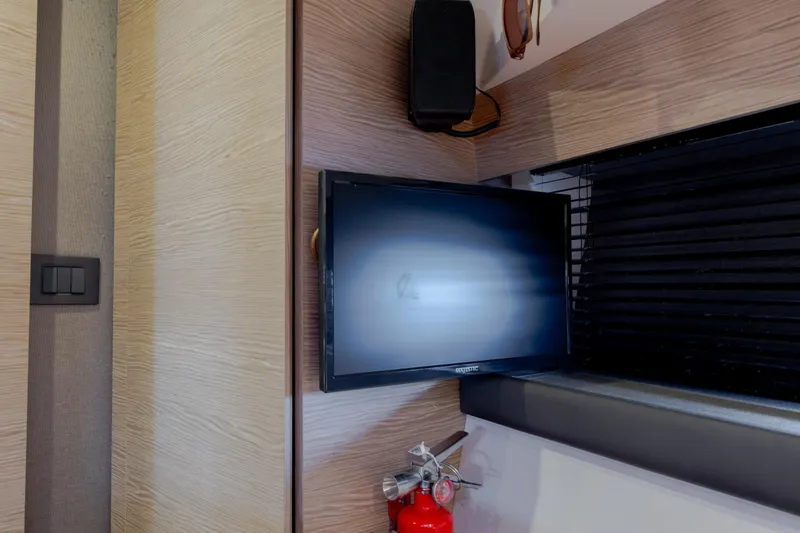  Yacht Photos Pics Interior of 2019 Azimut Verve 40 yacht with TV, speaker, and fire extinguisher.