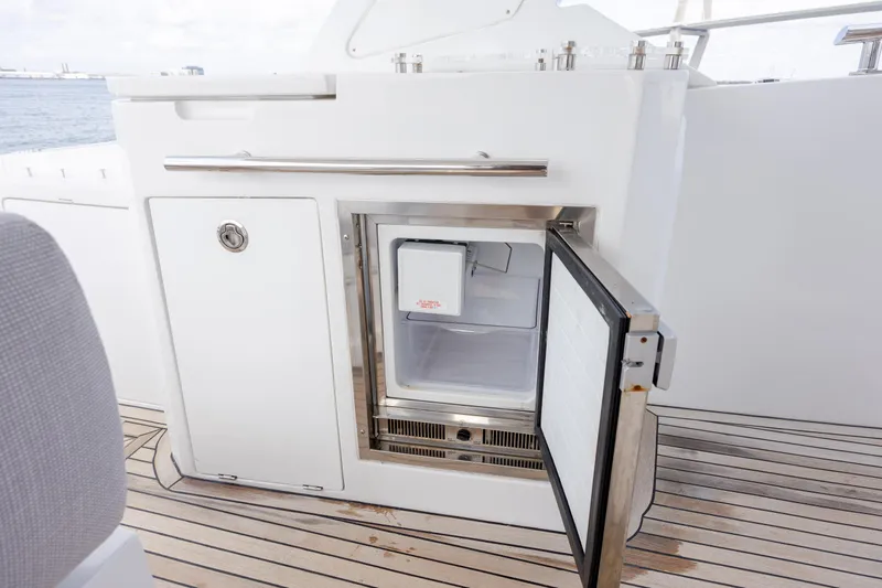  Yacht Photos Pics Open mini fridge on 2019 Azimut Verve 40 yacht deck, showcasing sleek design.