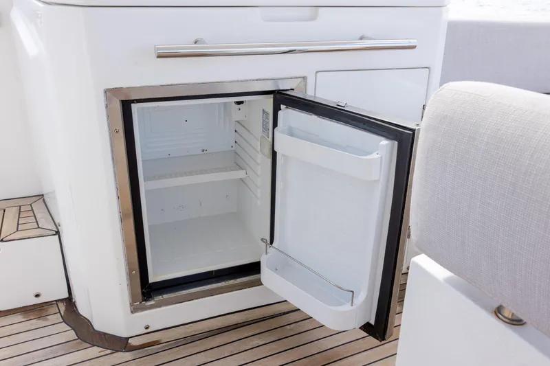  Yacht Photos Pics Open mini fridge on 2019 Azimut Verve 40 yacht with wooden deck flooring.