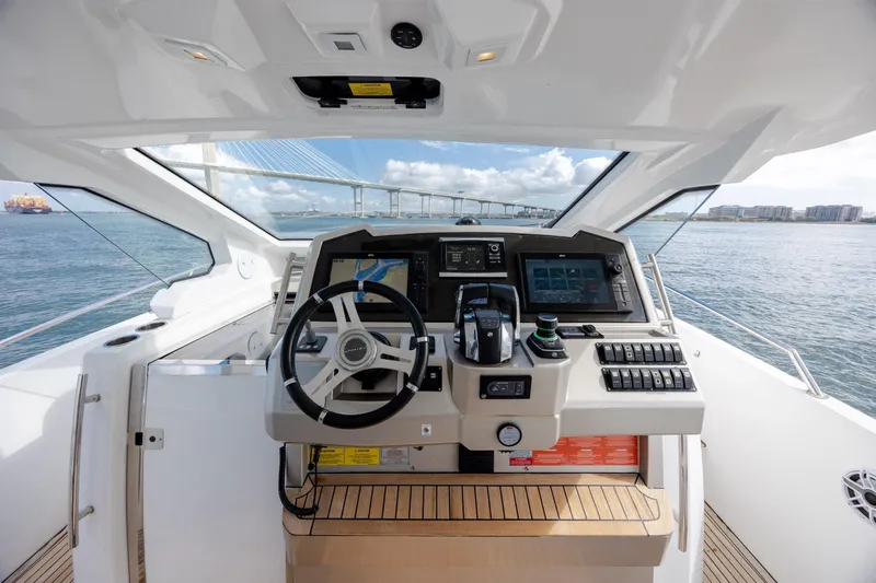  Yacht Photos Pics Cockpit view of 2019 Azimut Verve 40 yacht with navigation controls and ocean backdrop.