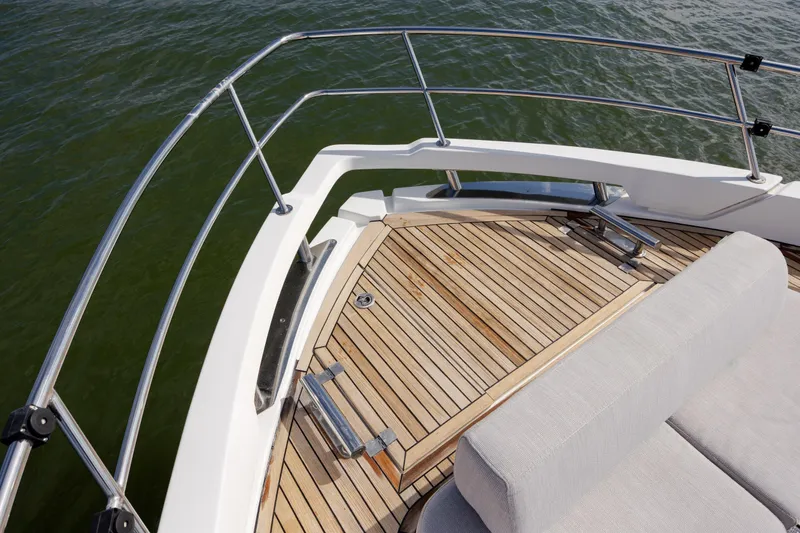  Yacht Photos Pics 2019 Azimut Verve 40 yacht deck with teak flooring and cushioned seating.