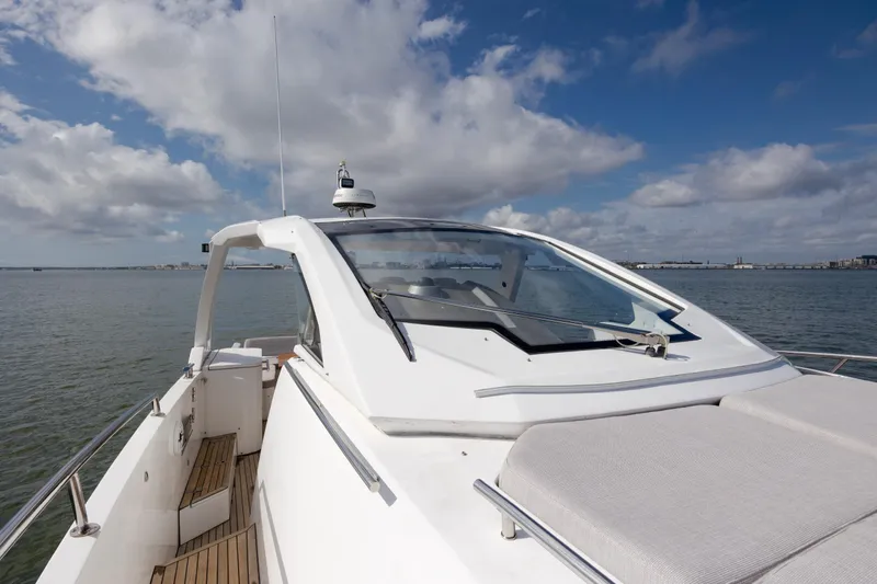  Yacht Photos Pics 2019 Azimut Verve 40 yacht on calm water under a partly cloudy sky.