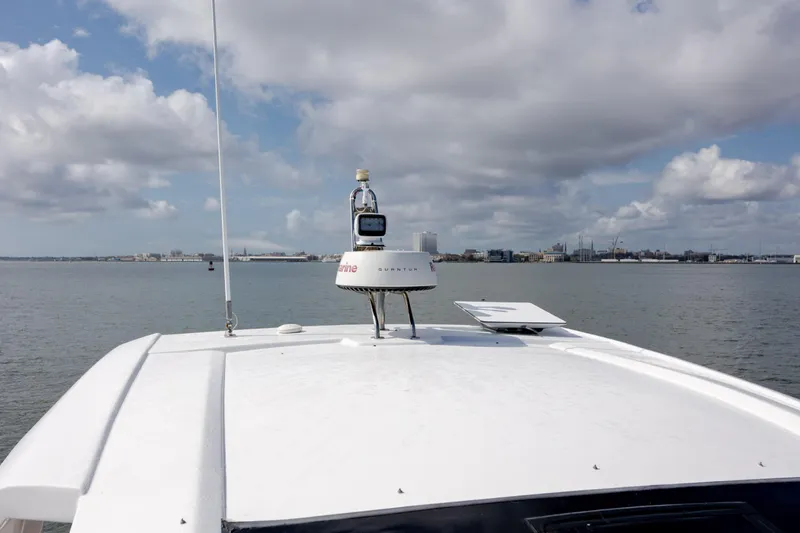  Yacht Photos Pics 2019 Azimut Verve 40 yacht roof with radar, overlooking calm waters and cloudy sky.