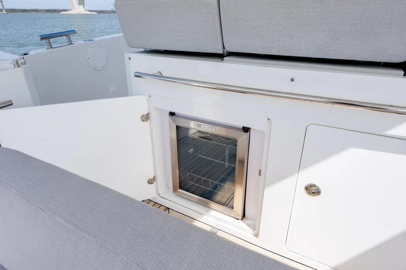  Yacht Photos Pics 2019 Azimut Verve 40 yacht interior with built-in mini fridge and seating area.