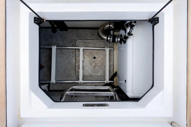  Yacht Photos Pics Engine compartment of 2019 Azimut Verve 40 yacht, featuring metal flooring and mechanical components.